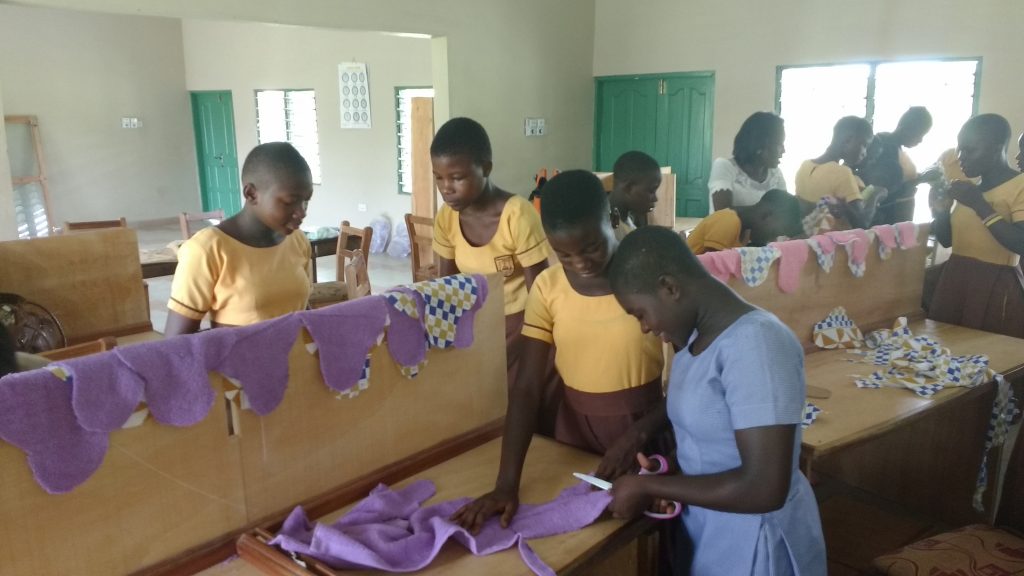 Girls learn how to make re-usable sanitary towels